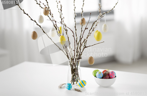 Image of pussy willow branches decorated by easter eggs