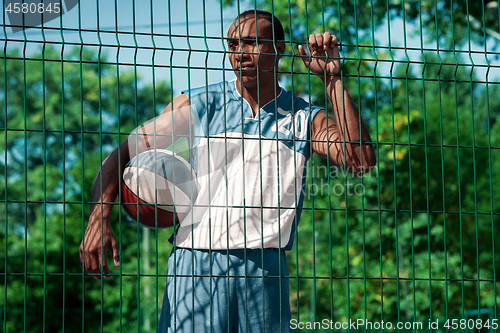 Image of Picture of young resting african basketball player