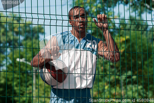 Image of Picture of young resting african basketball player