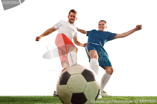 Image of Football players tackling for the ball over white background