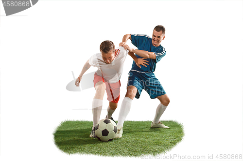 Image of Football players tackling for the ball over white background