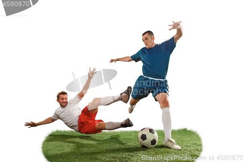 Image of Football players tackling for the ball over white background