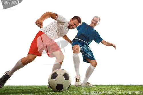 Image of Football players tackling for the ball over white background