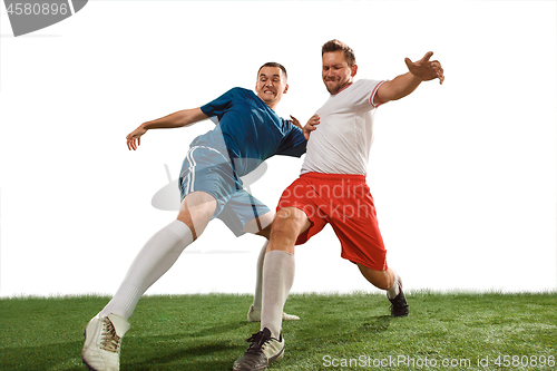 Image of Football players tackling for the ball over white background