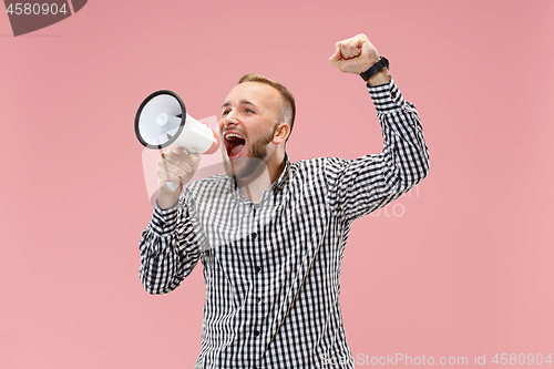 Image of man making announcement with megaphone