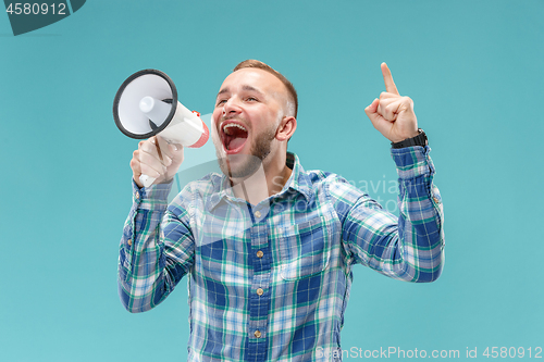 Image of man making announcement with megaphone