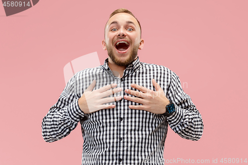 Image of Winning success man happy ecstatic celebrating being a winner. Dynamic energetic image of male model