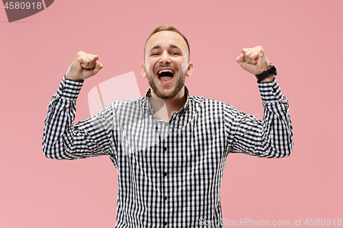 Image of Winning success man happy ecstatic celebrating being a winner. Dynamic energetic image of male model