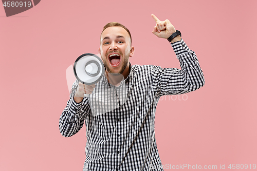 Image of man making announcement with megaphone