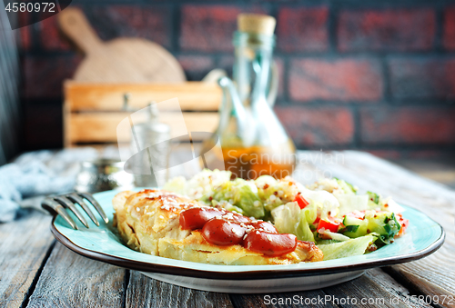 Image of fried chicken breast and salad