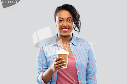 Image of happy african american woman drinking coffee