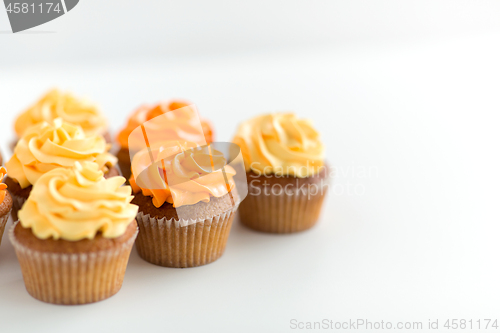 Image of cupcakes with frosting on white background