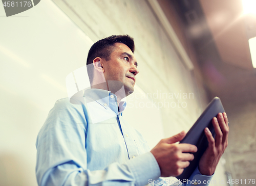 Image of teacher or lector with tablet pc at lecture