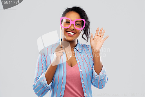 Image of happy african american woman with big glasses