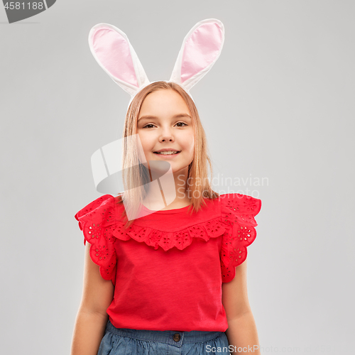 Image of happy girl wearing easter bunny ears headband