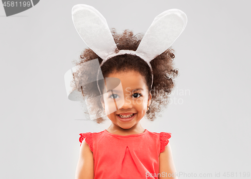 Image of happy little girl wearing easter bunny ears