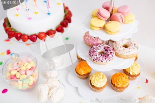 Image of food and drinks on table at birthday party