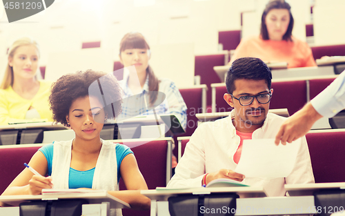 Image of international students with test on lecture