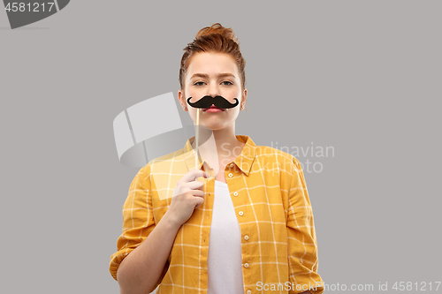 Image of red haired teenage girl with black moustaches