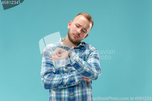 Image of Beautiful bored man bored isolated on blue background