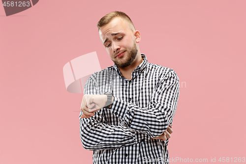 Image of Beautiful bored man bored isolated on pink background