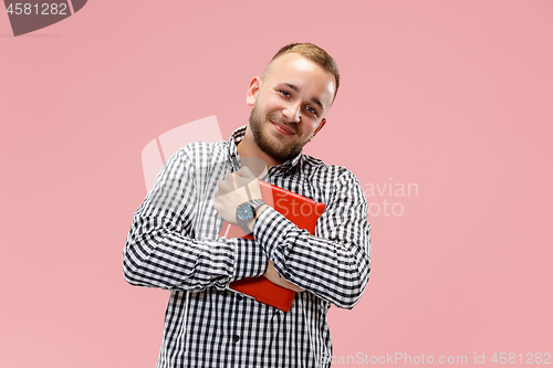 Image of Businessman hugging laptop