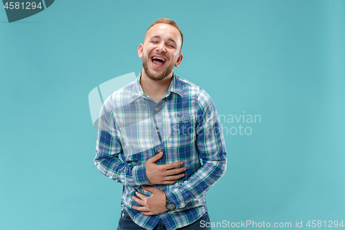 Image of The happy business man standing and smiling against pink background.