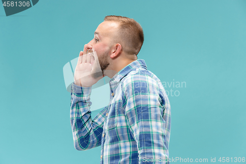 Image of Isolated on pink young casual man shouting at studio