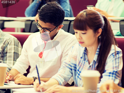 Image of group of students with coffee writing on lecture