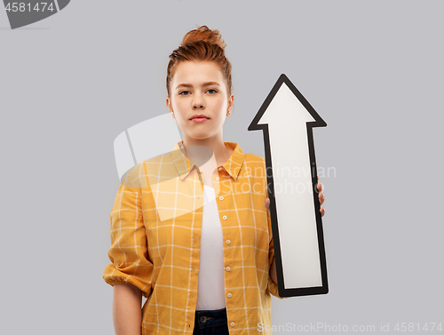 Image of red haired teenage girl with arrow showing up