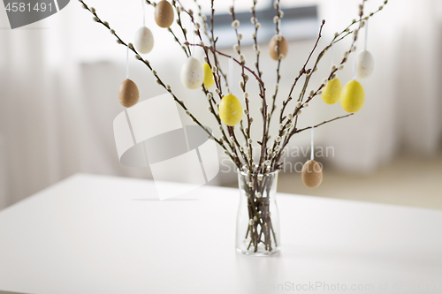 Image of pussy willow branches decorated by easter eggs