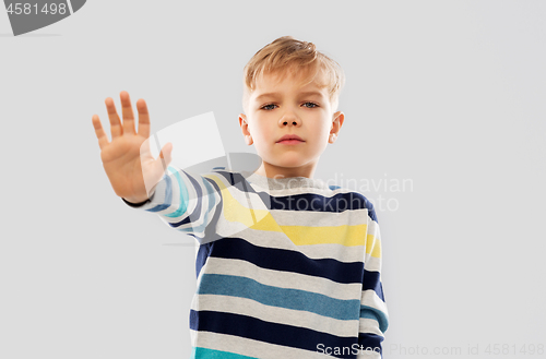 Image of little boy in striped pullover