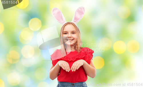 Image of happy girl wearing easter bunny ears headband