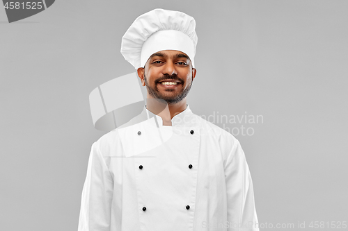 Image of happy male indian chef in toque