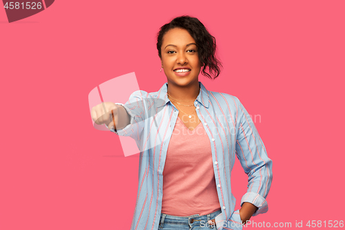 Image of african american woman pointing finger to you