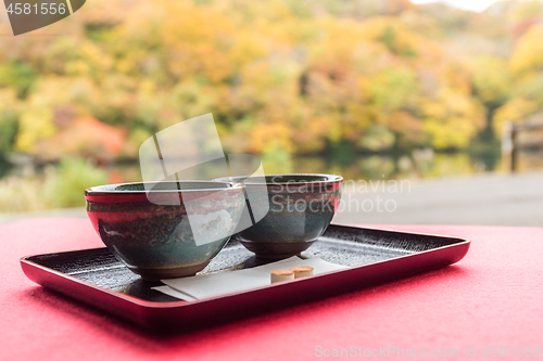 Image of Japanese green tea with autumn background