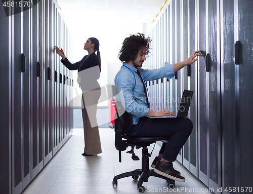 Image of technicians working together on servers