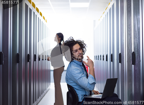 Image of technicians working together on servers