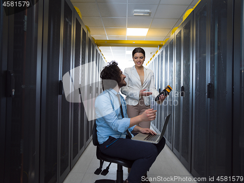 Image of technicians working together on servers