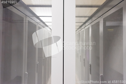 Image of modern server room with white servers