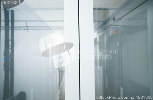 Image of modern server room with white servers