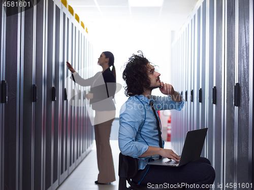 Image of technicians working together on servers