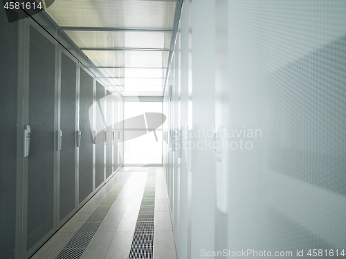 Image of modern server room with white servers