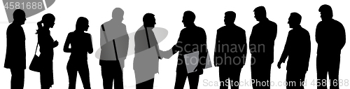 Image of Business group at a meeting shaking hands and one businessman holding folder with contract