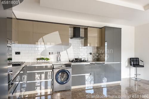 Image of Luxury modern white, beige and grey kitchen interior