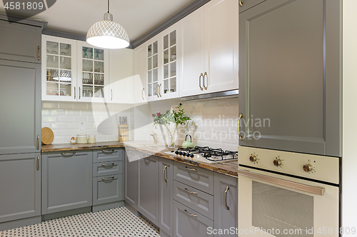 Image of modern grey and white wooden kitchen interior