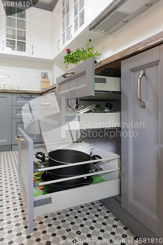 Image of modern grey and white wooden kitchen interior