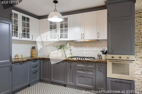 Image of modern grey and white wooden kitchen interior