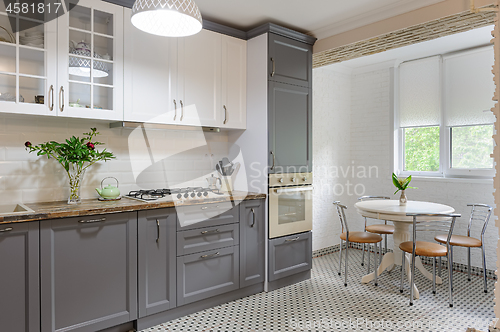 Image of modern grey and white wooden kitchen interior