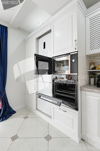 Image of modern white wooden kitchen interior